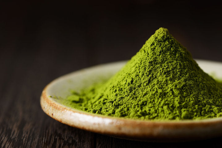 matcha powder in a hill shaped formation on a plate