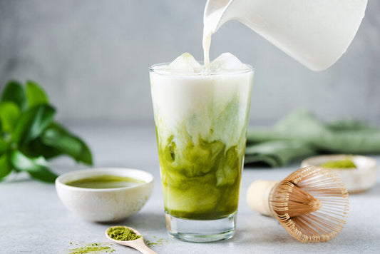 Soy milk pouring in matcha ice tea