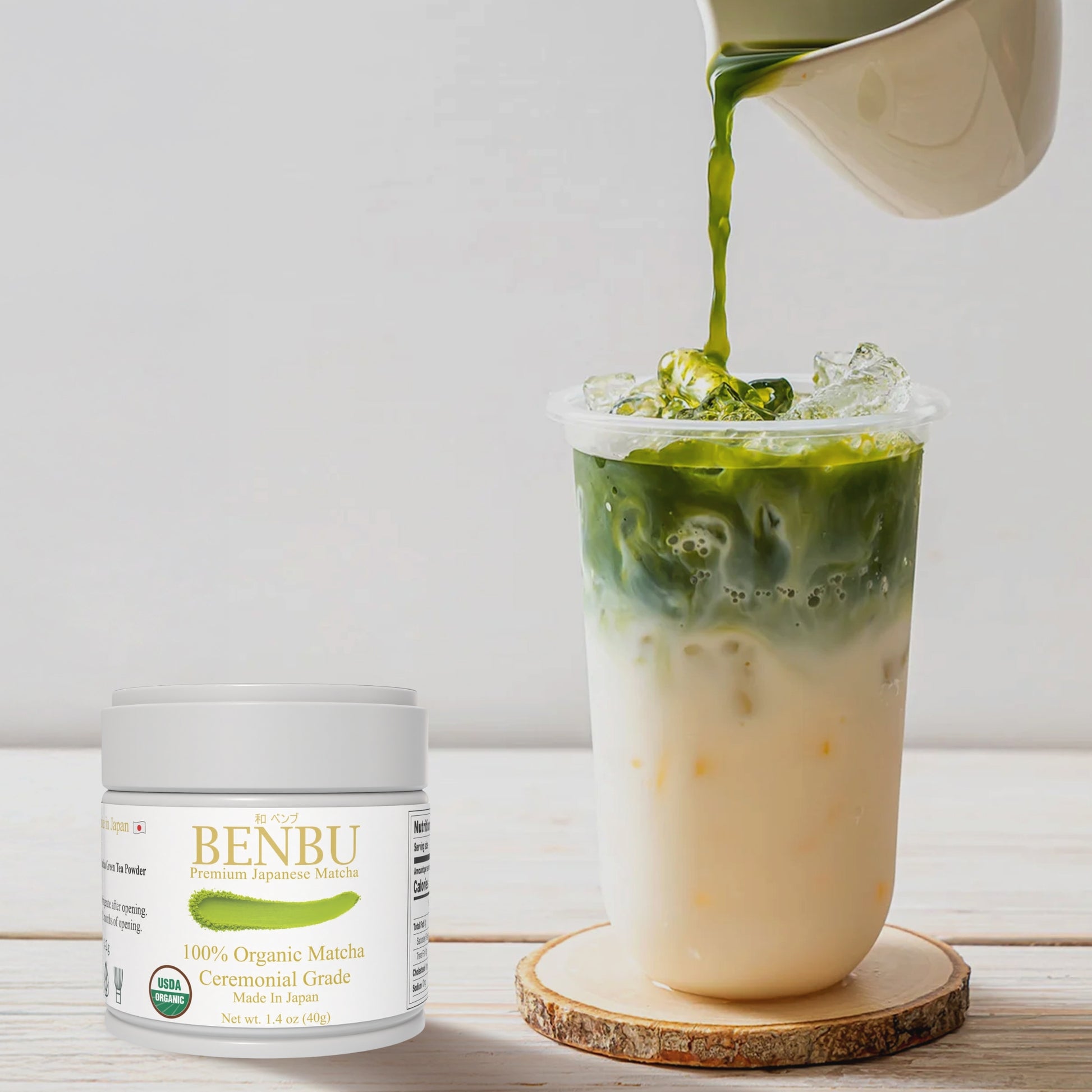 BENBU organic Ceremonial Grade Matcha 40g Tin next to iced matcha latte being poured – premium Japanese matcha